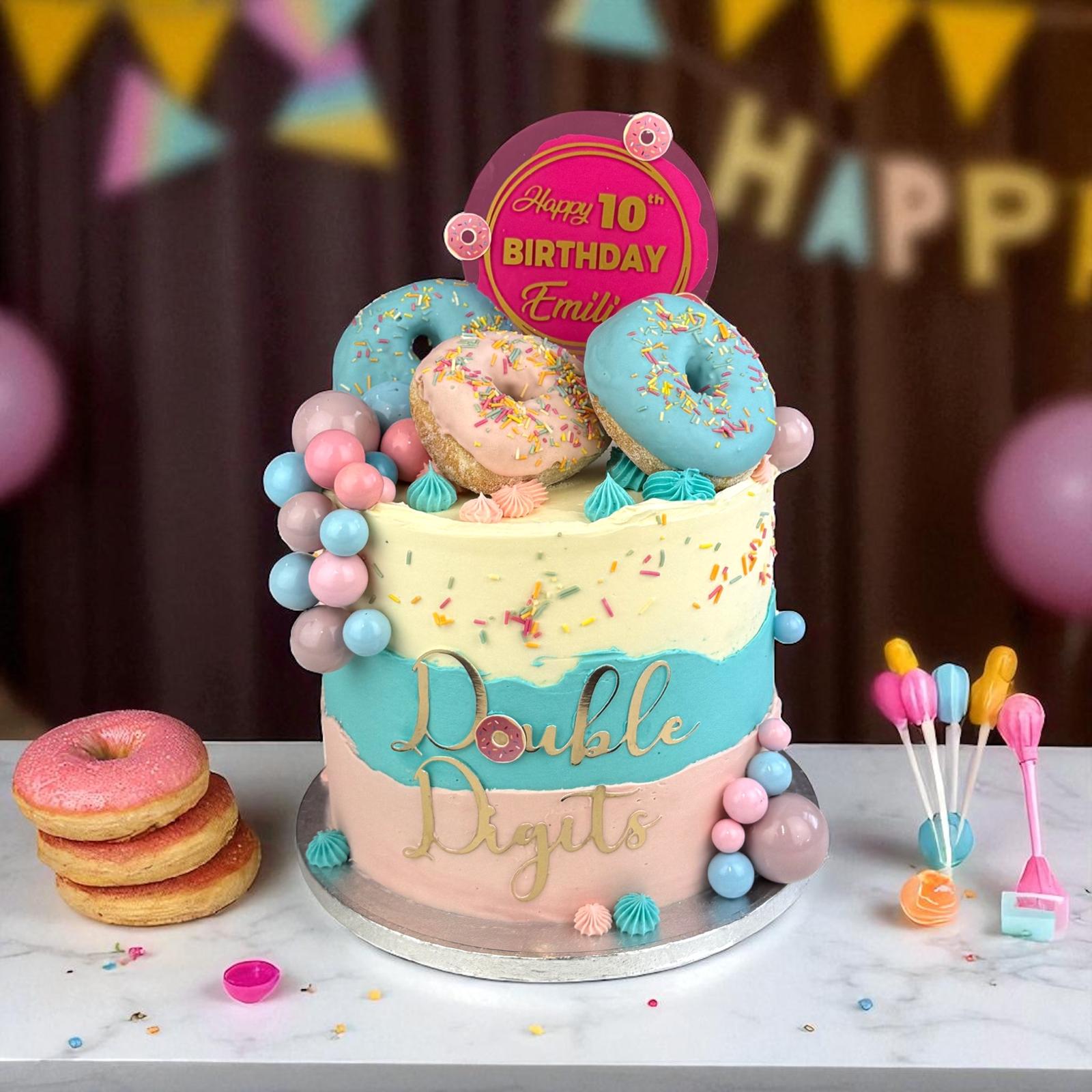 Personalised birthday cake with doughnuts by Alex’s Bakery, Manchester