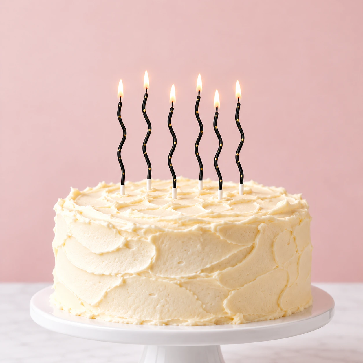 Black & Gold Dot Wave Candles – Box of 6 - six realistically sized candles on a cake