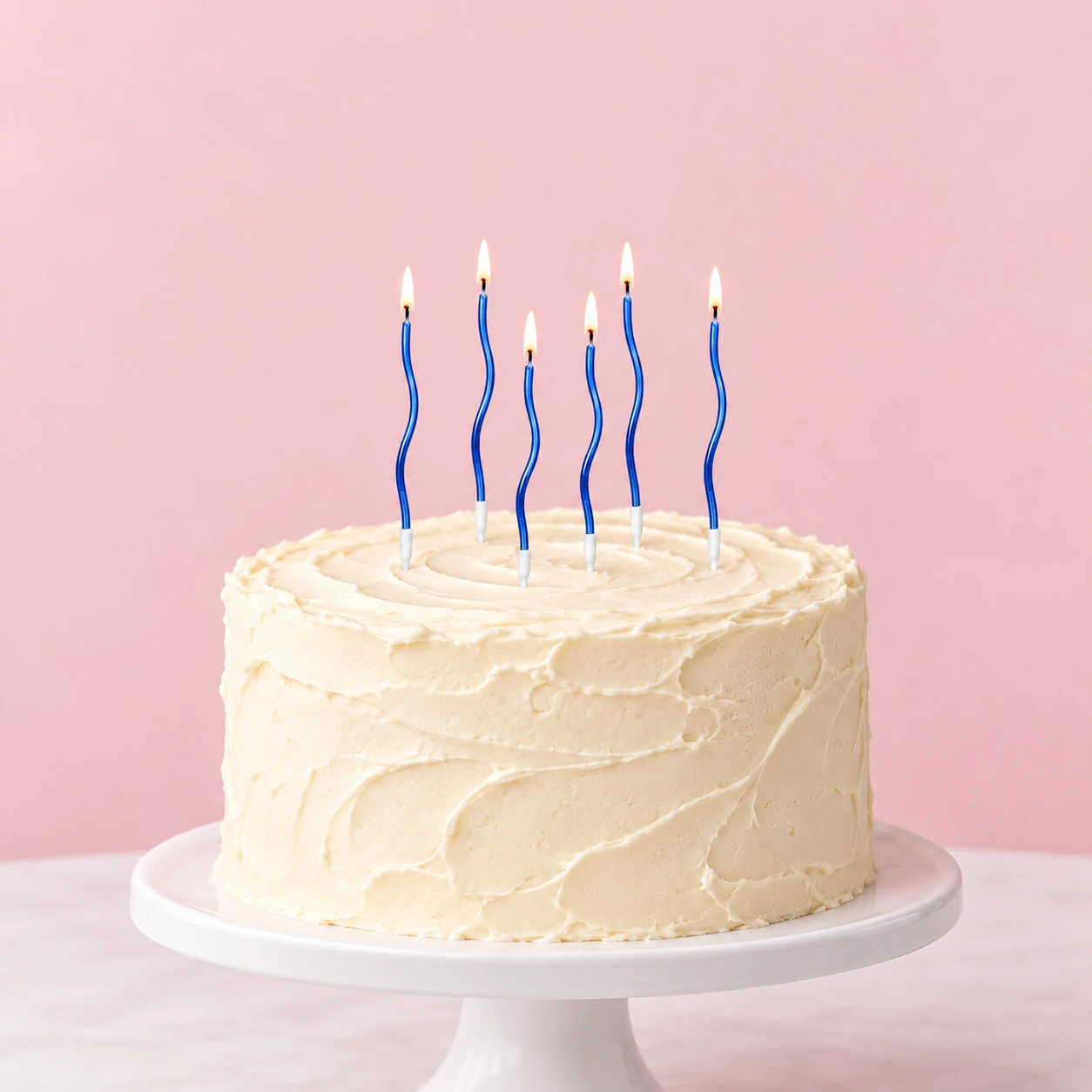 Metallic Blue Wave Candles – Box of 6 - six realistically sized candles on a cake